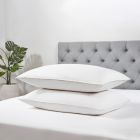 All Natural Duck Feather & Down Pillows, Pair stacked on bed