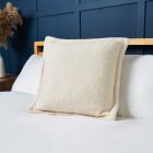 Boucle Cushion with Flange Edge, Cream Styled on Bed