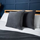 Small Microfleece Cushion, Charcoal Styled on Bed