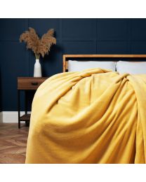 Jumbo Snugglie Fleece Throw, Ochre Styled on Bed