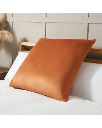 Large Velour Piped Cushion, Burnt Orange on bed