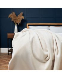 Plain Faux Fur Throw, Cream Styled on Bed