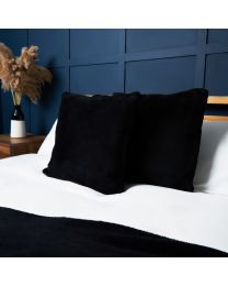 Small Microfleece Cushion, Black Styled on Bed