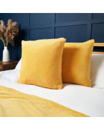 Small Microfleece Cushion, Ochre Styled on Bed