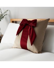 Velvet Bow Gift Wrap Cushion, Red and Natural on bed