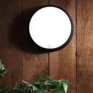 Bulkhead outdoor outlet light with sensor