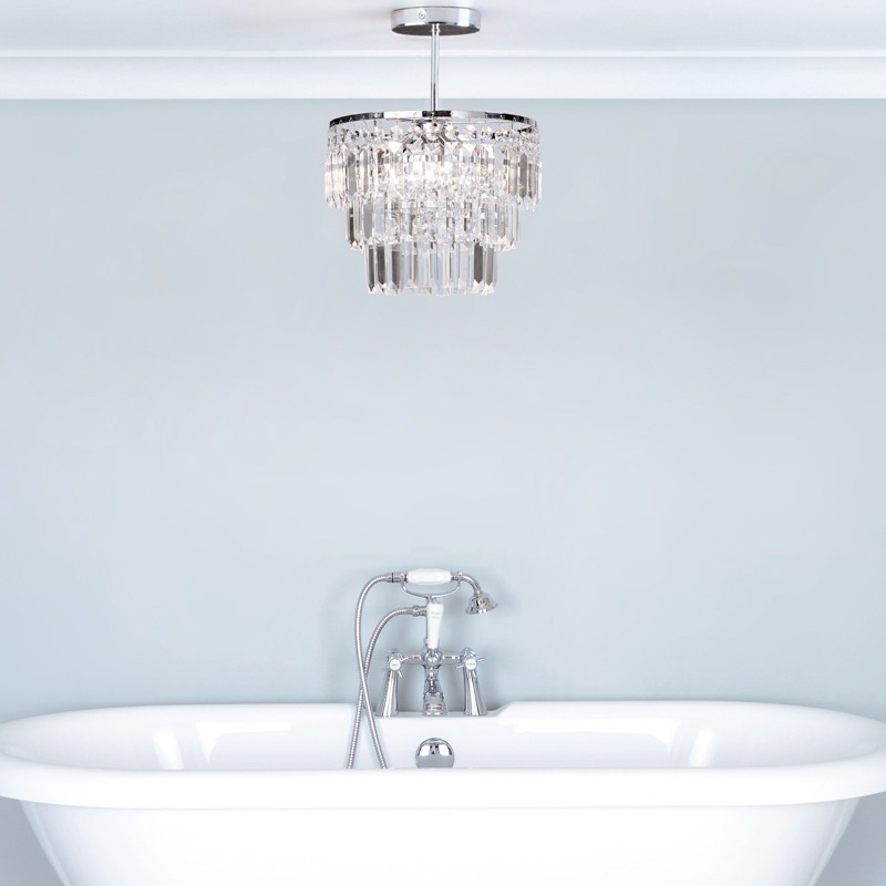 Crystal ceiling pendant hung over a bath